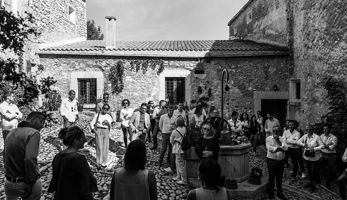 We return to the courtyard to chat in the shade of the farm